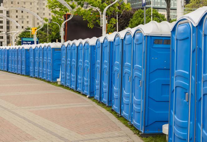 a line of portable restrooms set up for a wedding or special event, ensuring guests have access to comfortable and clean facilities throughout the duration of the celebration in Atlanta